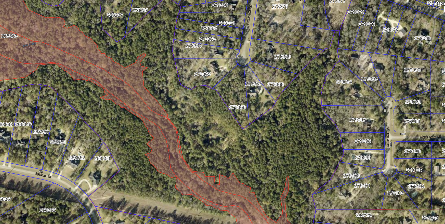 Satellite aerial view of the property showing dense woodland and surrounding parcels